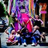 Staff of the Lower East Side Girls' Club pose in front of 'Girlzilla' who just may make an appearance at the New Ideas Festival street fair.